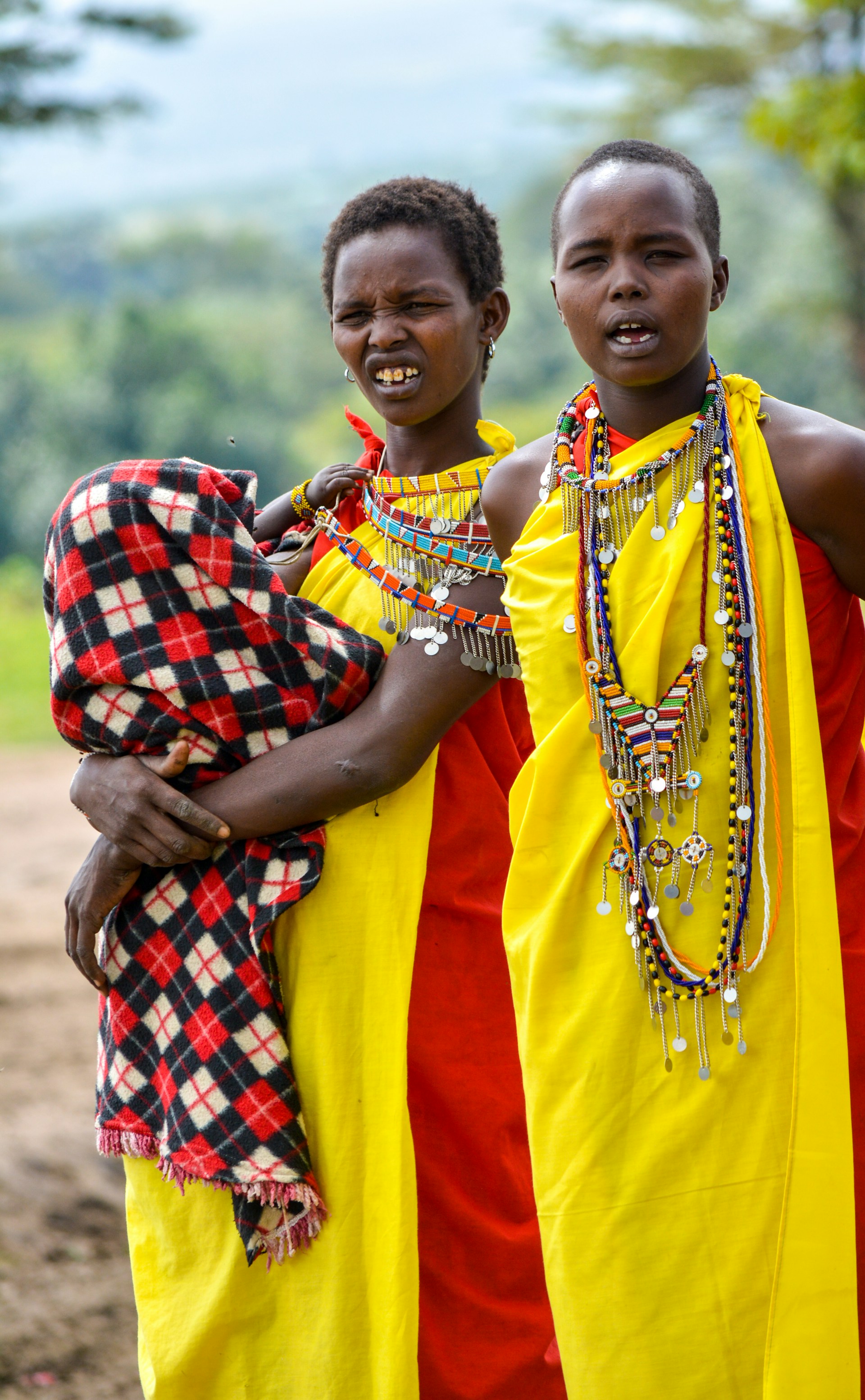 People in traditional dress with a child — community and culture